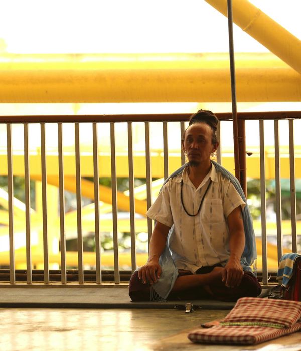 Man practicing calm rhythmic breathing in a modern interior